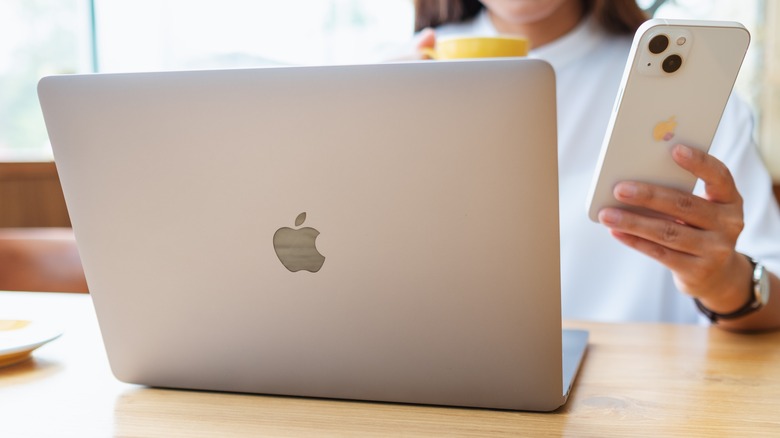 iPhone and a MacBook laptop.