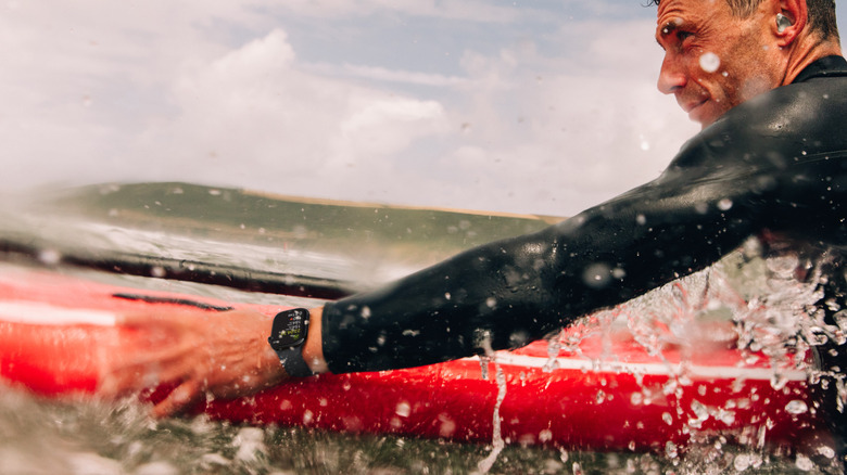 Person paddle-boarding wearing an Apple Watch Series 10