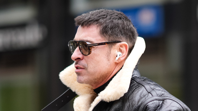 Person wearing AirPods earbuds