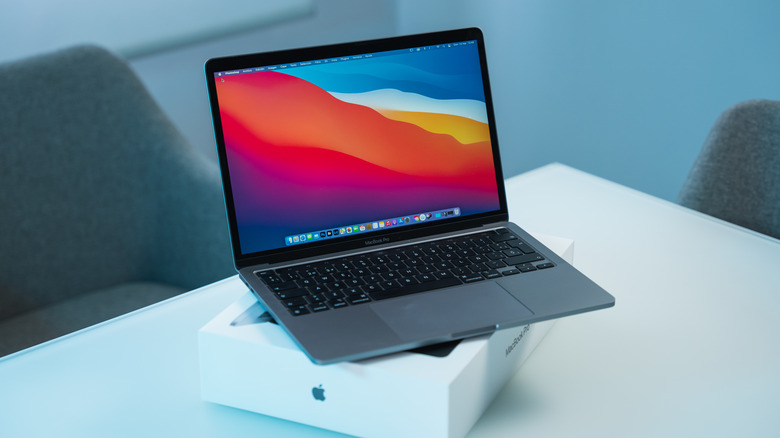 Apple MacBook on top of retail box