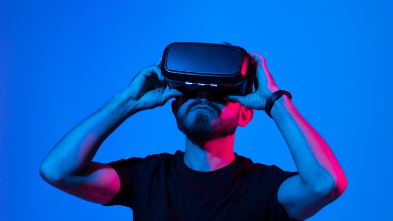 Person holding VR headset