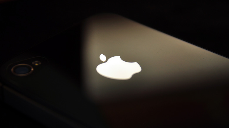 Close-up of Apple logo on phone