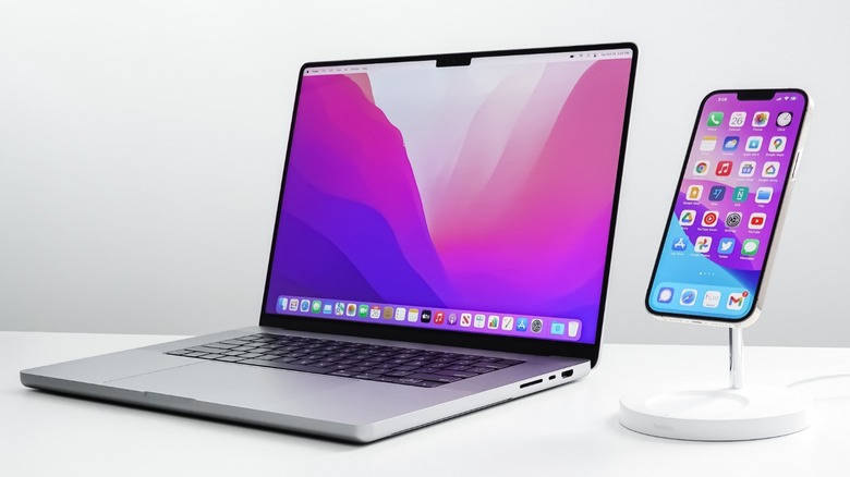 MacBook and iPhone, both with notched displays