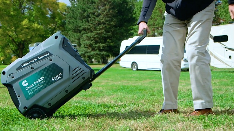 Cummins Onan P4500i Being Moved With Telescoping Handle