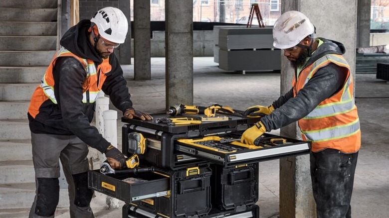 Workers using DeWalt ToughSystem 2.0 workstation