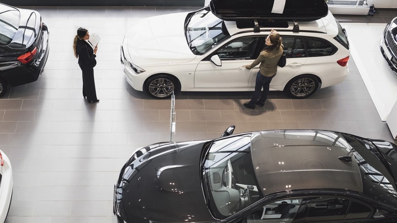 Dealership interior with cars