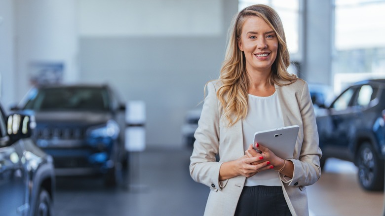 Salesperson at car dealership