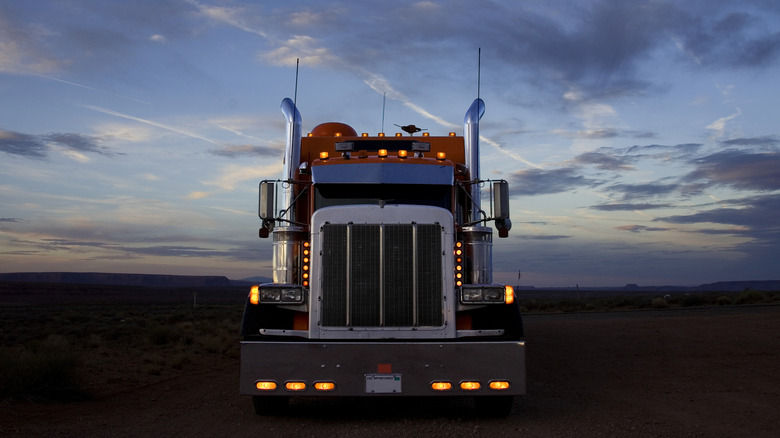 Semi-Truck parked in lot at dusk