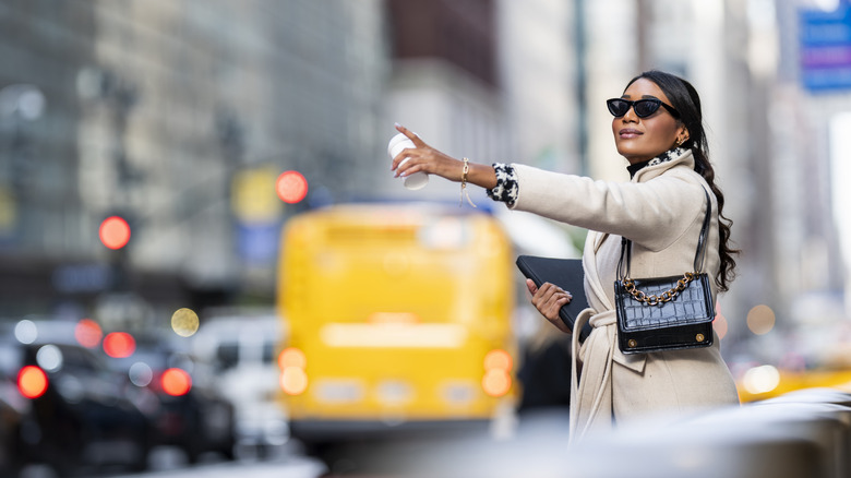 Woman hailing a cab