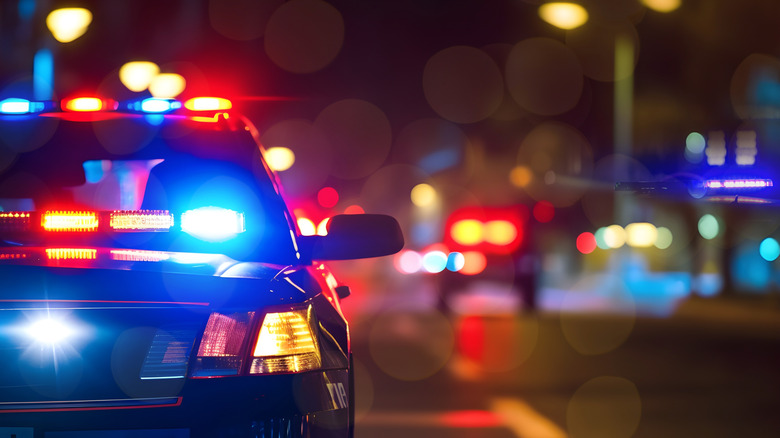 Police lights on a busy street.