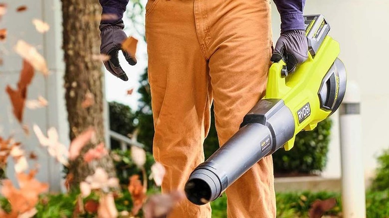 Person using Ryobi leaf blower