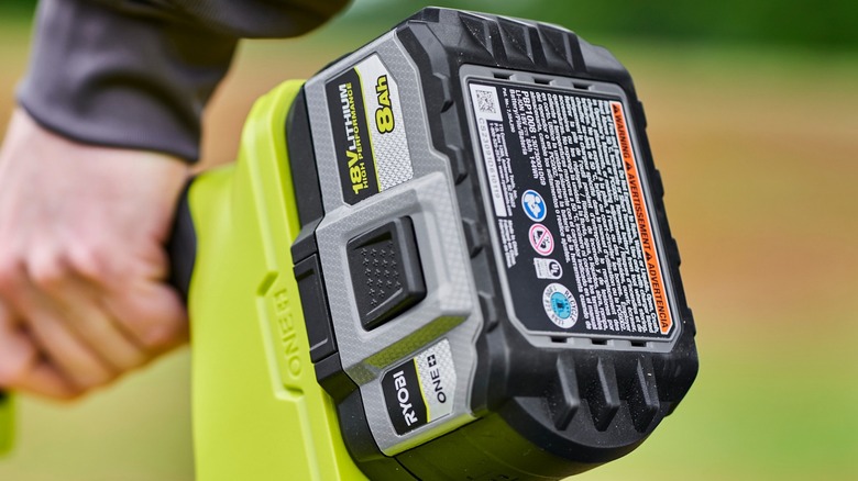 Ryobi battery on lawn maintenance tool