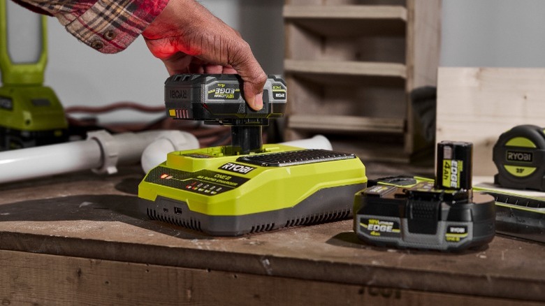 Person charging Ryobi battery