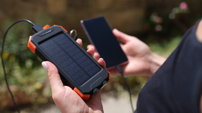 Solar charger connected to smartphone