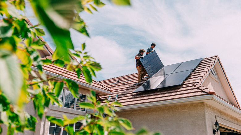 Men installing solar panels