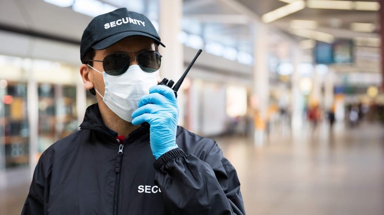 Airport security guard talking