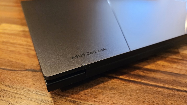 Asus Zenbook 14 OLED 2024 logo etching on a corner of the laptop.