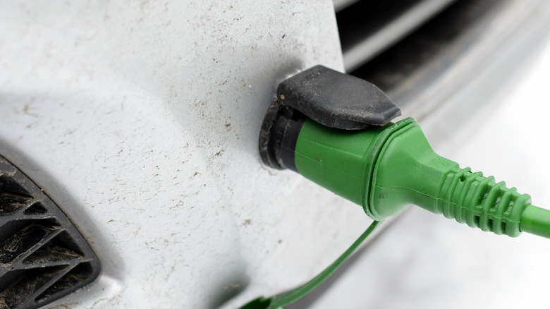 A block heater's power cord connected to a car.