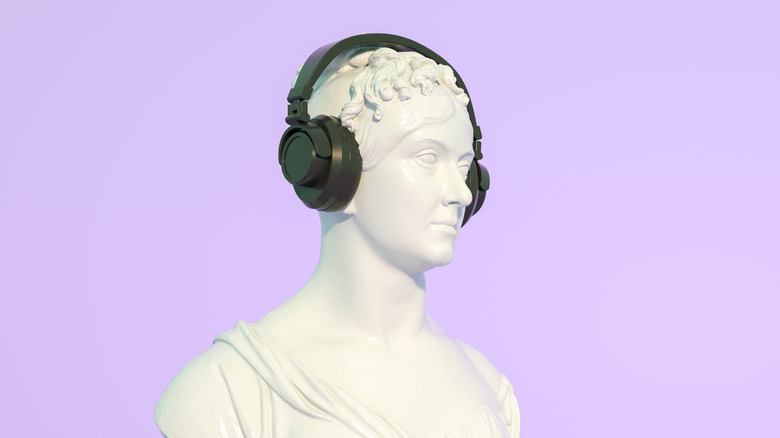 A sculpture wearing headphones