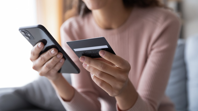 Woman smartphone and credit card