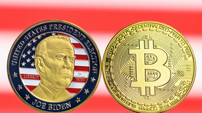 Coin of President Biden and a Bitcoin token.