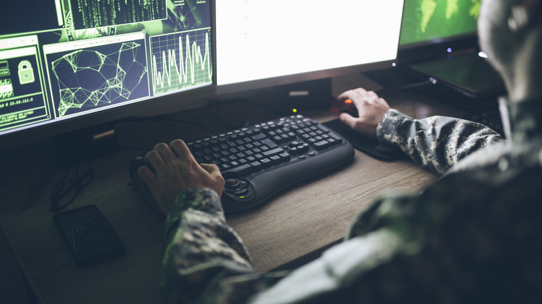 An American soldier operating a computer.