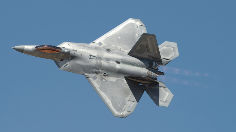 F-22 Raptor flying blue sky