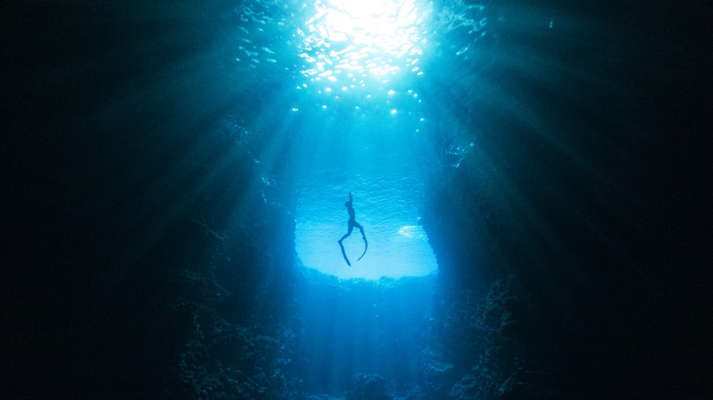 Diver in deep ocean water