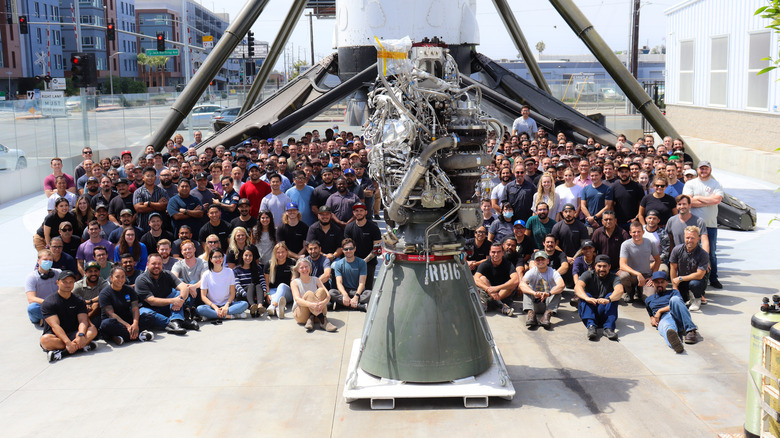 SpaceX Raptor posed with development team