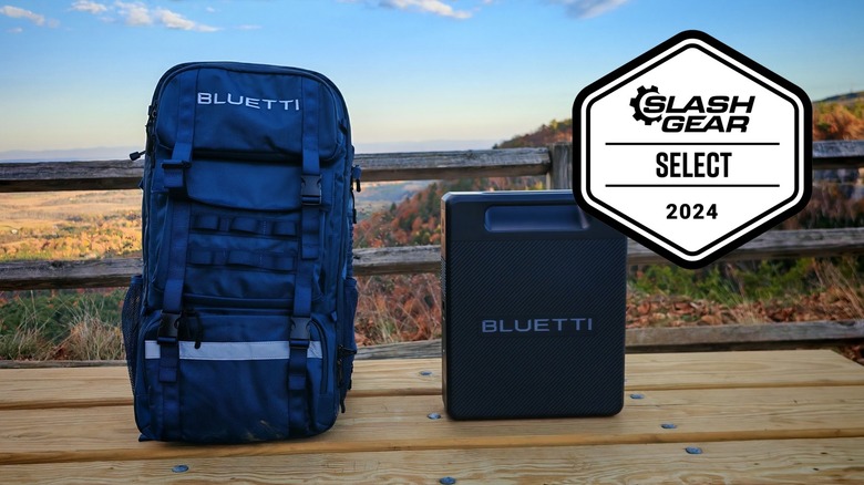 The Bluetti Handsfree 2 and backpack on a picnic table with a cliff in the background.