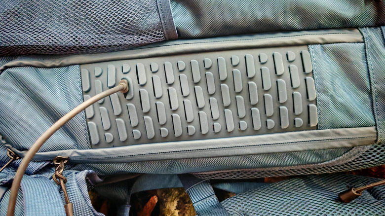 USB C cable being run through the side of the backpack on the Bluetti Handsfree 2