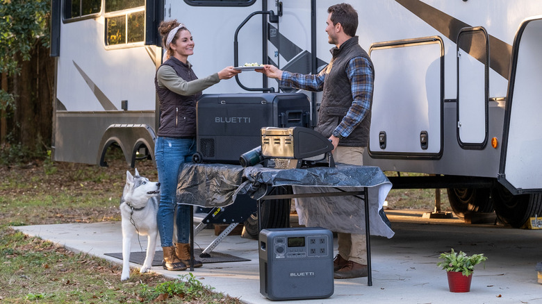 people using Bluetti SwapSolar at campsite 