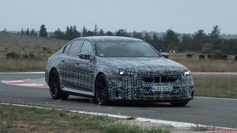 Disguised 2025 BMW M5 tested on a track