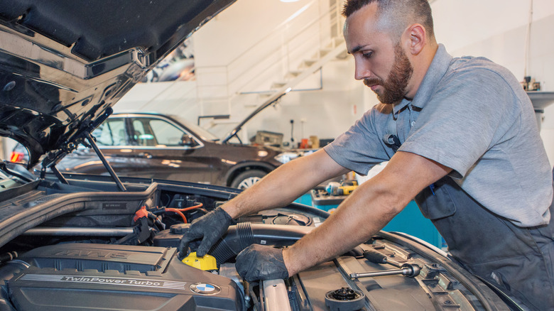 A BMW engine bay being worked on 