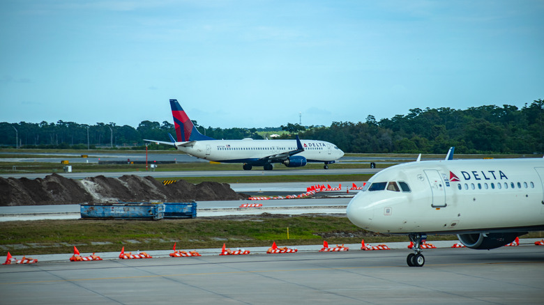 Delta Airlines Airbius A320 and a Delta Airlines Boeing 737 in the background