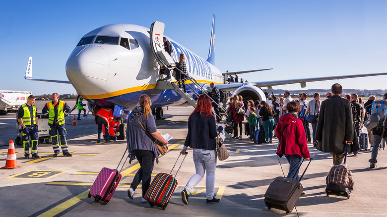 Passengers boarding a Boeing 737 aircraft