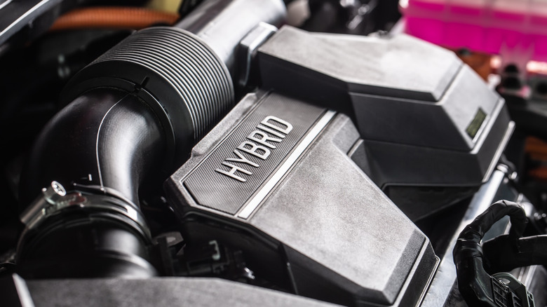 Close-up shot of an open hybrid car engine