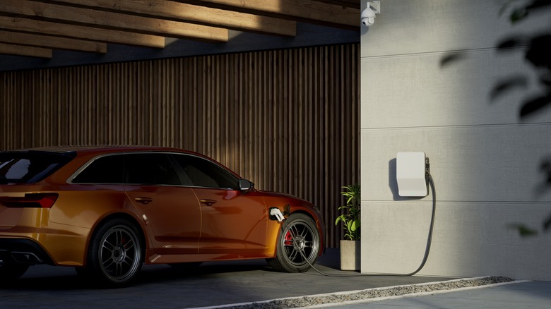 An EV being charged in a garage.