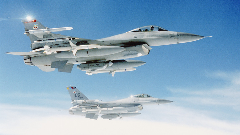 Two F-16 Fighting Falcons flying in formation for an exercise in Nevada