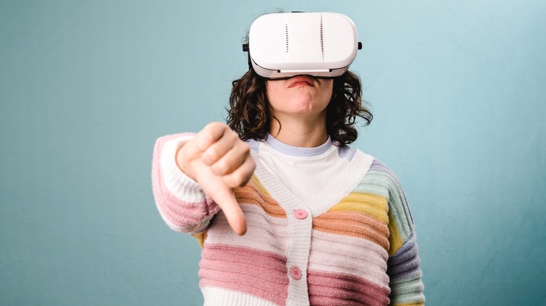 woman thumbs down vr headset