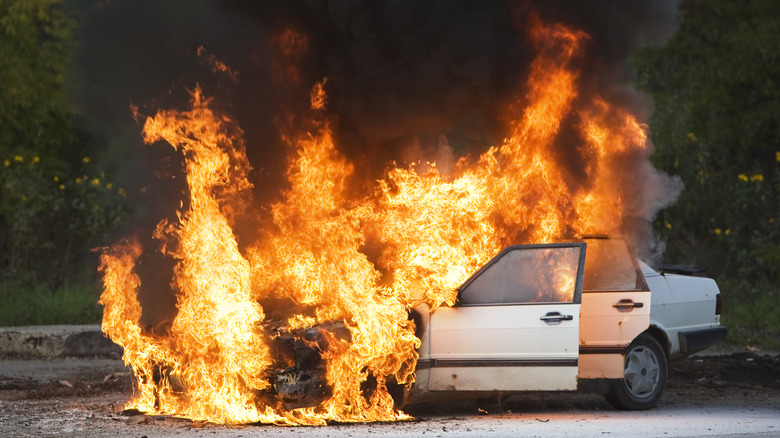 car on fire in road