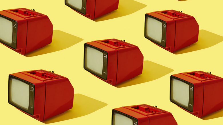 red analog CRT TVs repeated on yellow background