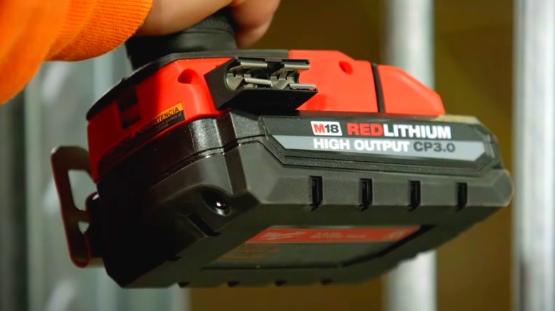 A Milwaukee battery attached to a Milwaukee tool