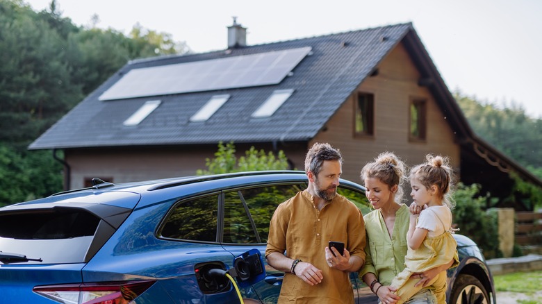 A home with solar panels in the background