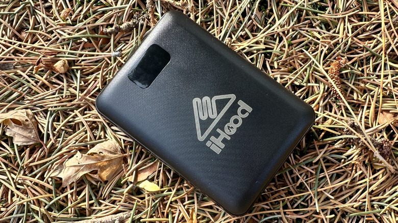 iHood power bank sitting on pine needles