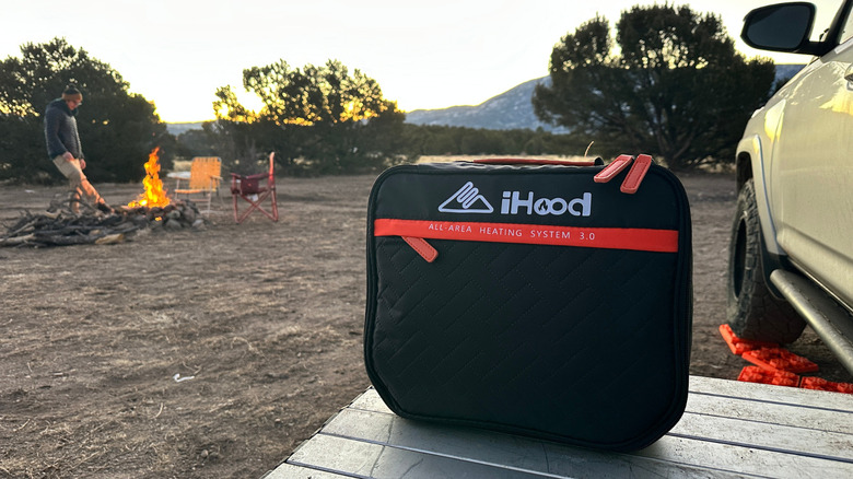 Heated vest carrying case outside with fire in the background