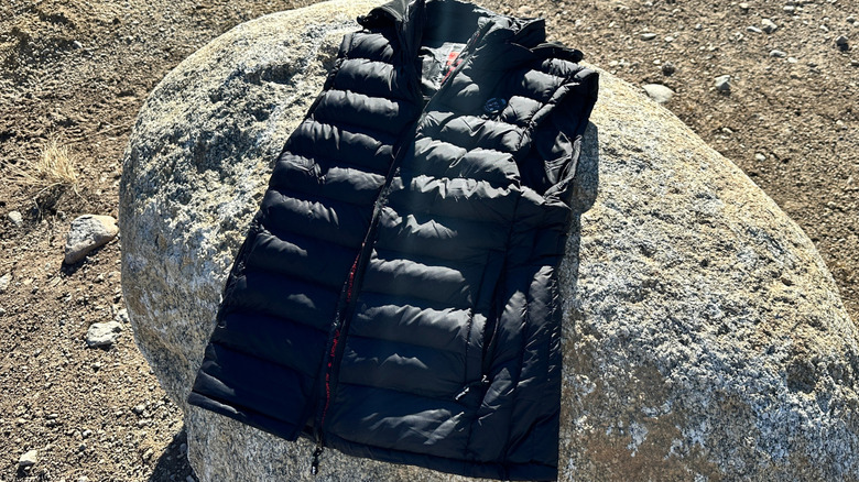 Heated vest laying on a rock