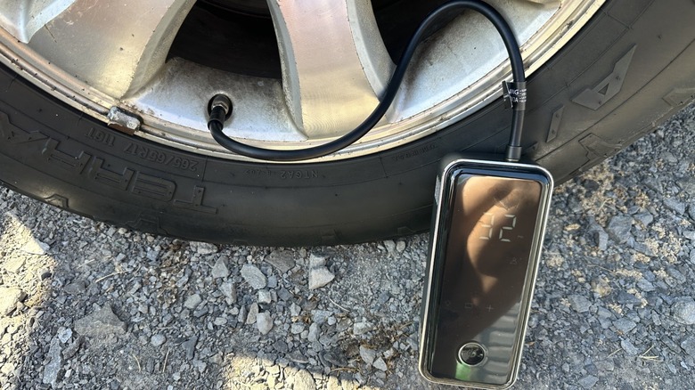 Air inflator connected to a truck tire