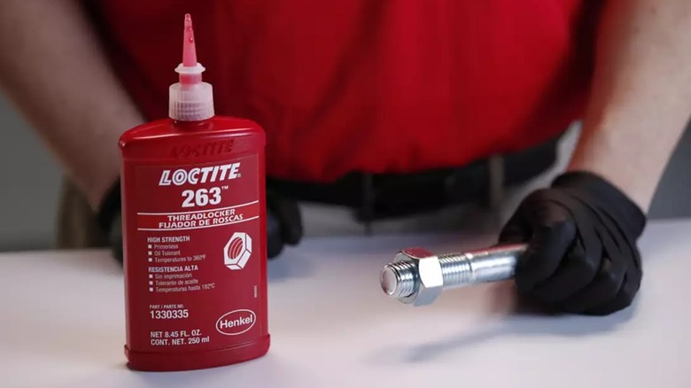 Loctite red threadlocker applied to bolt