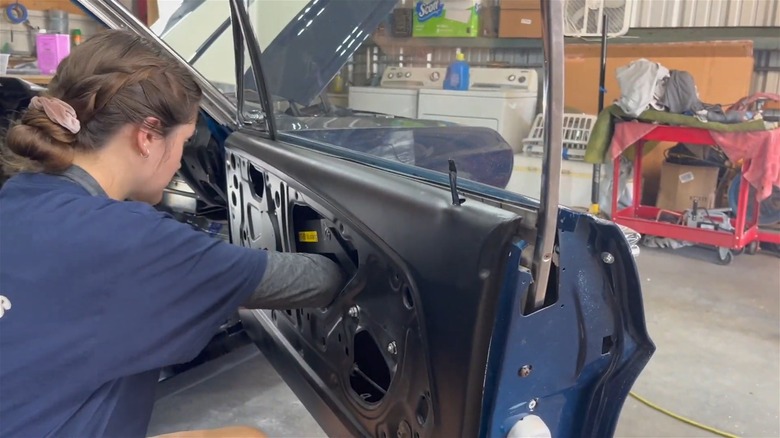 Woman Installing Remote Keyless Entry On 67 Mustang